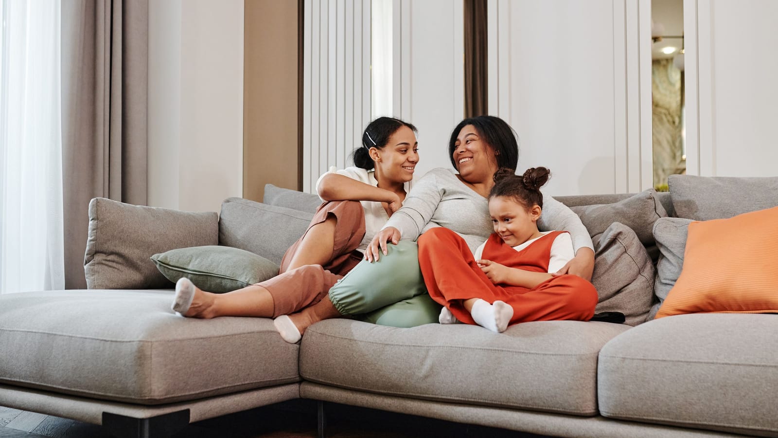 A family relaxing together on a spotless sofa
